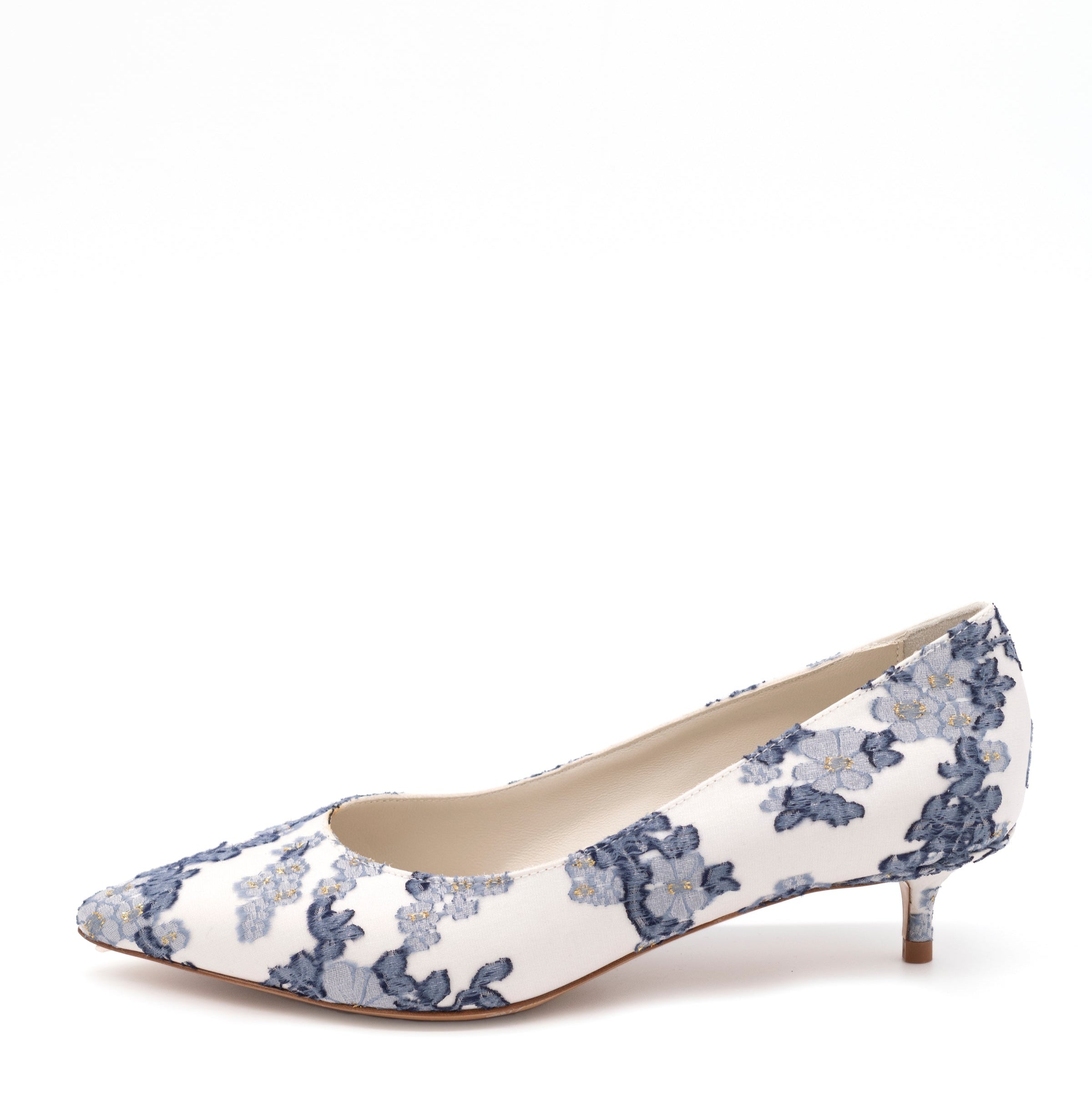A white pump with a blue floral pattern and a kitten heel.
