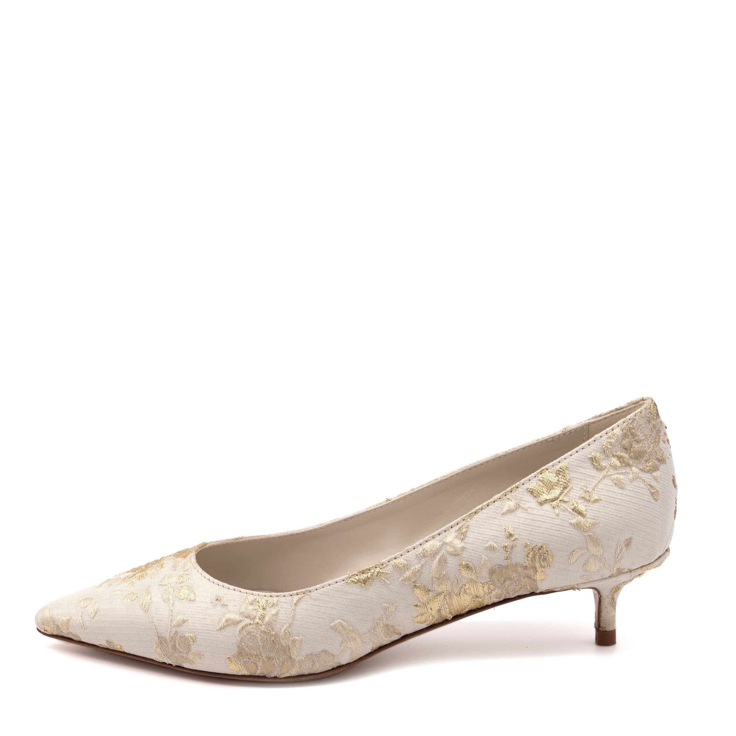 White shoe with gold floral pattern on a white background