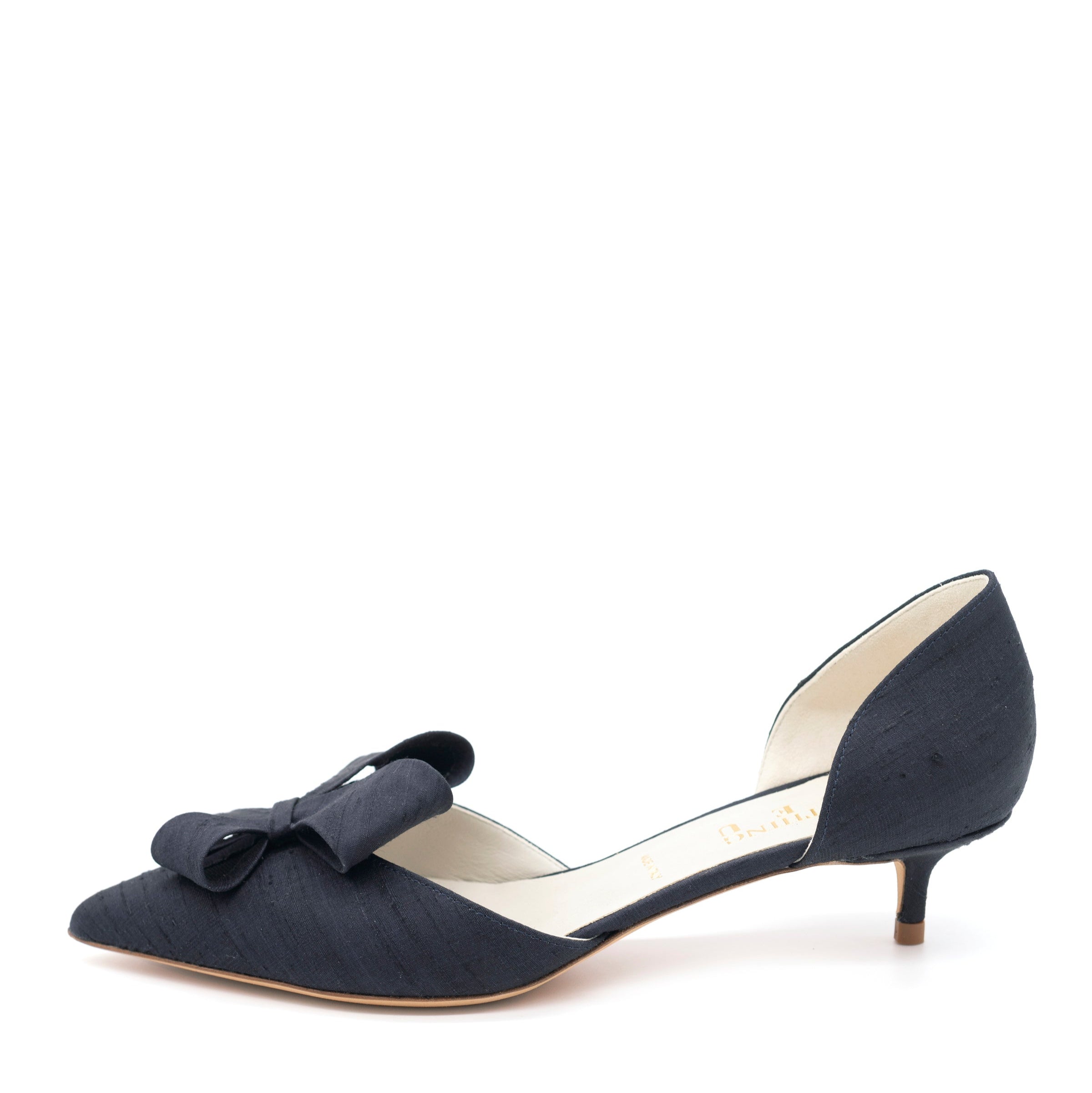 A navy pointed toe d'Orsay shoe with a bow detail and kitten heel.
