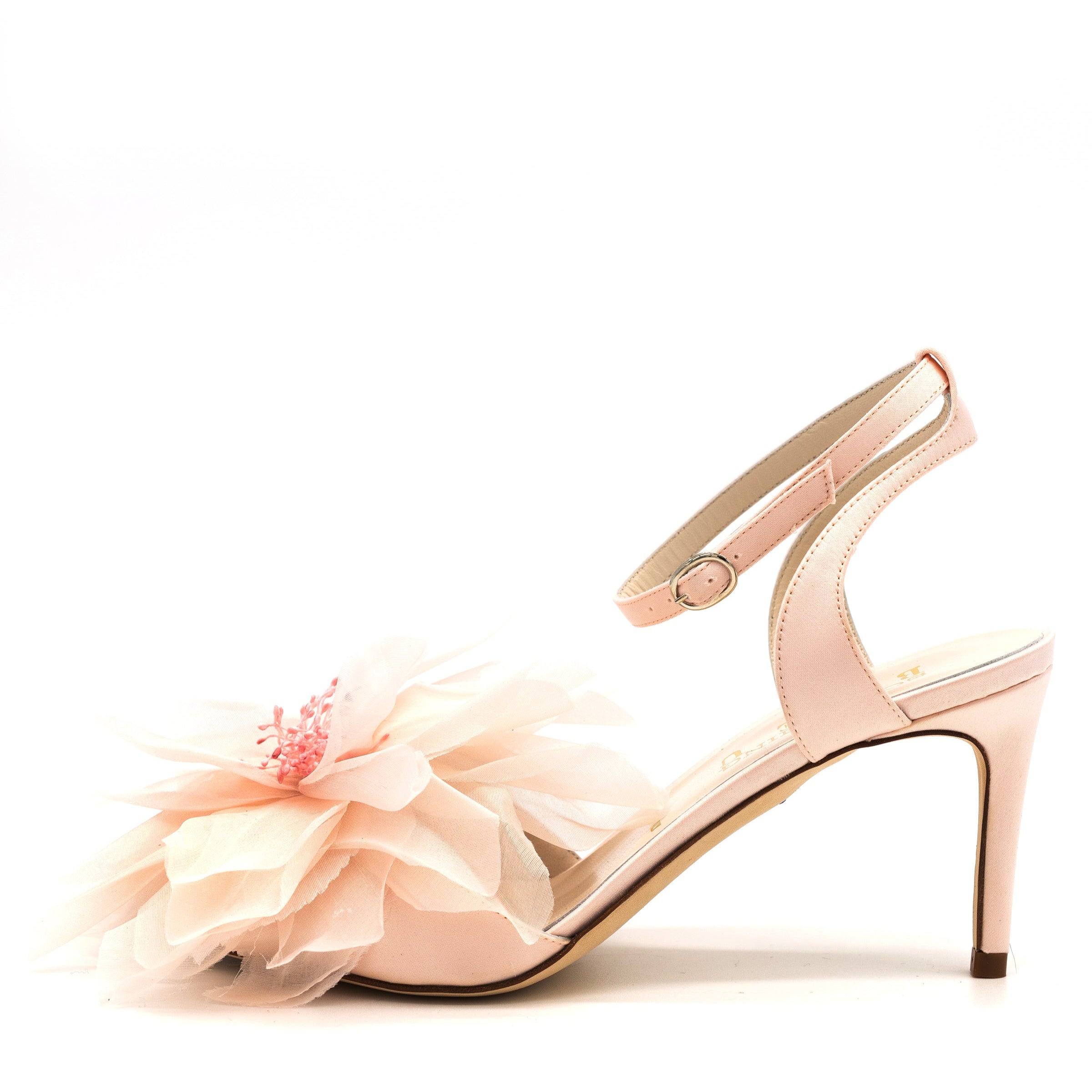 A pair of blush pink satin sandals with a floral design on the upper and a 2.95 inch heel.