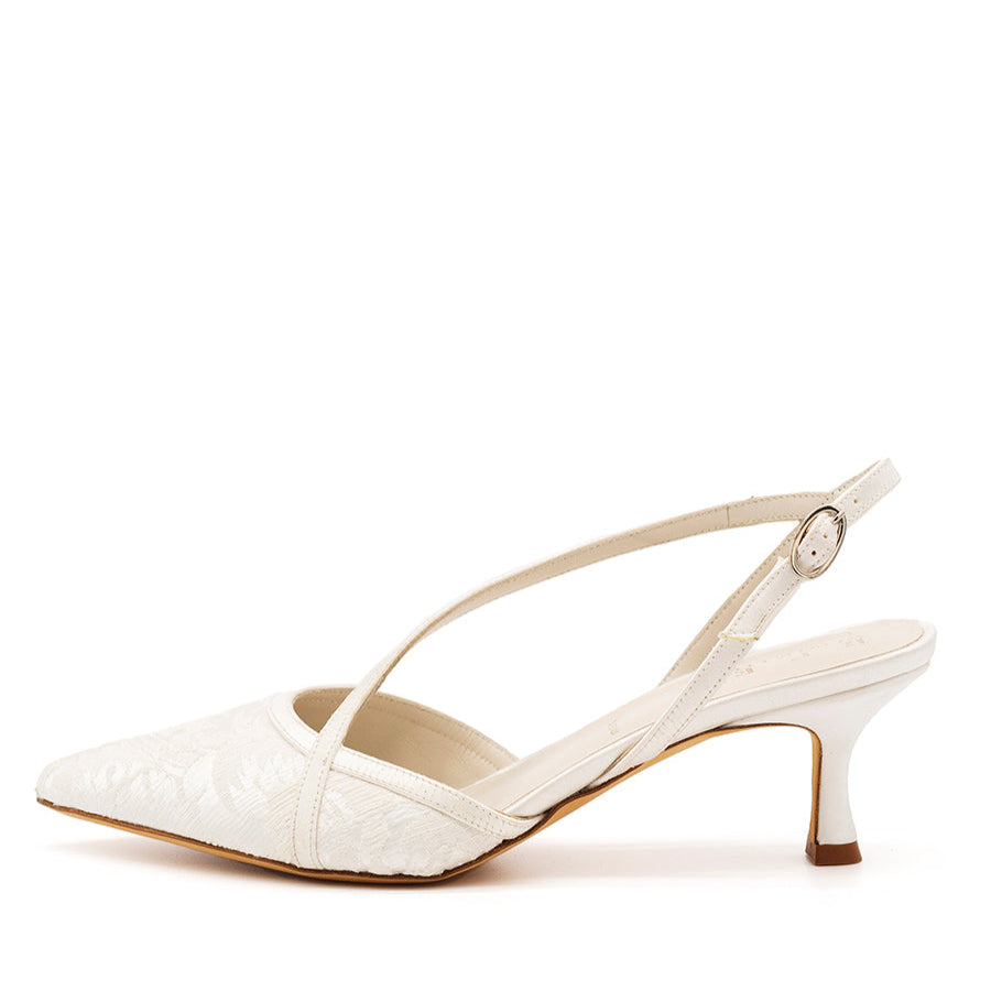 A white silk slingback kitten heel shoe with a pointed toe and adjustable ankle strap.