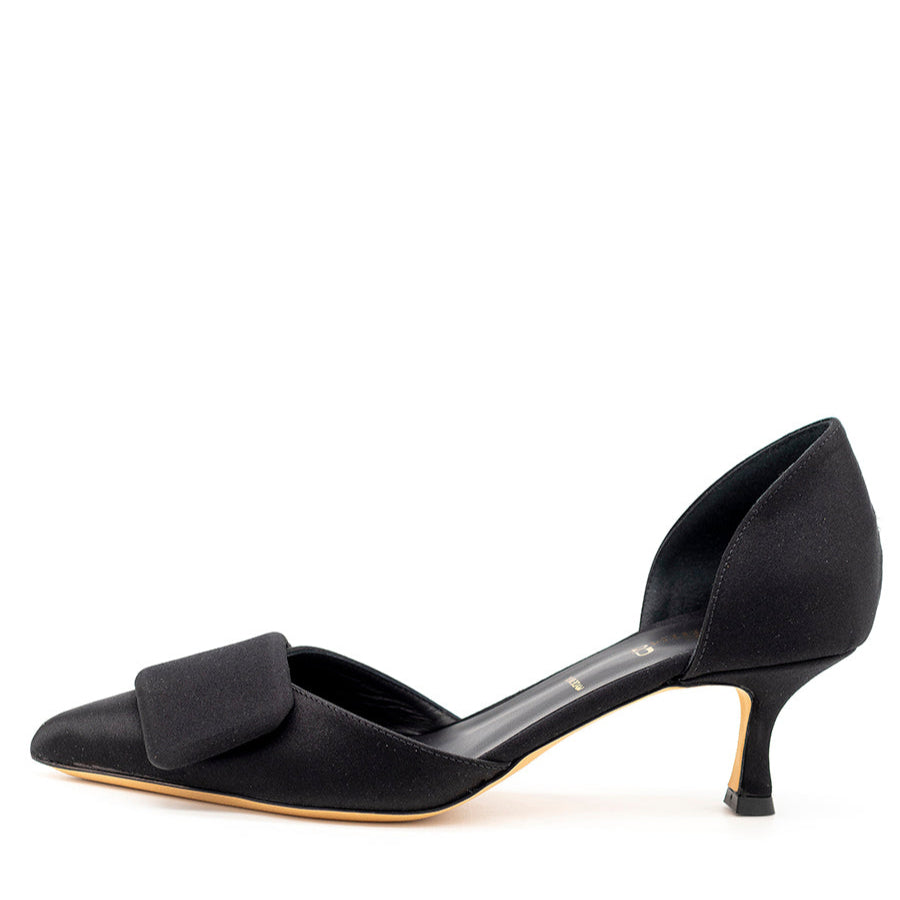 Black kitten heel pump with a satin upper and a bow detail on the vamp, set on a white background.