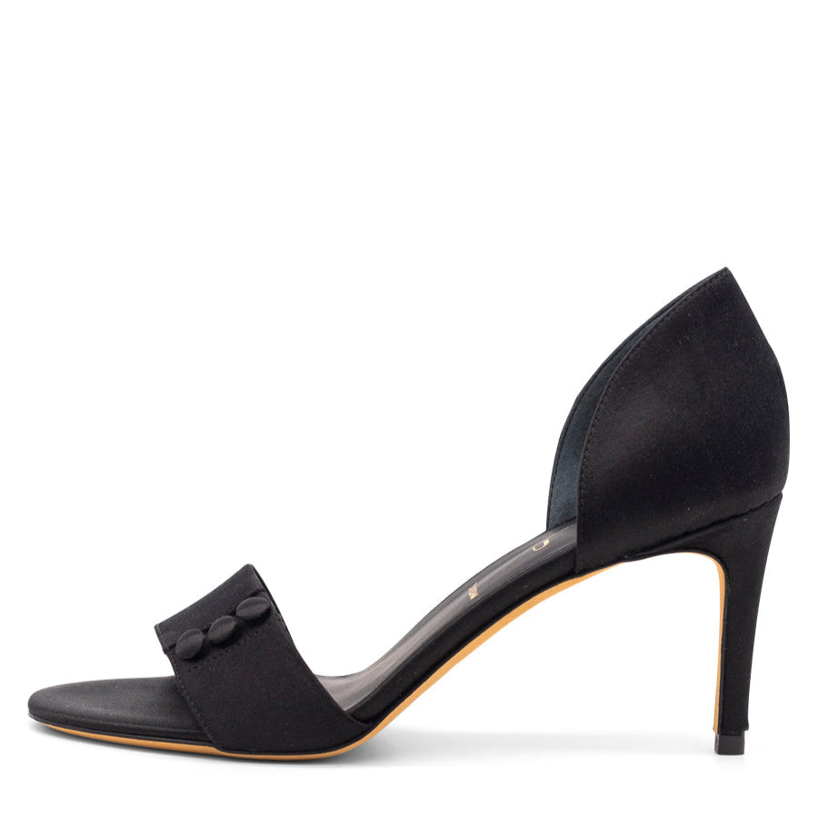 A black satin heel with button details and a leather sole.