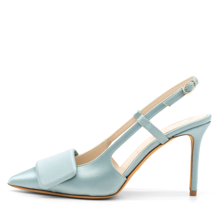 A classic pointed toe slingback pump with rectangle embellishment at the toe, in a light blue color.