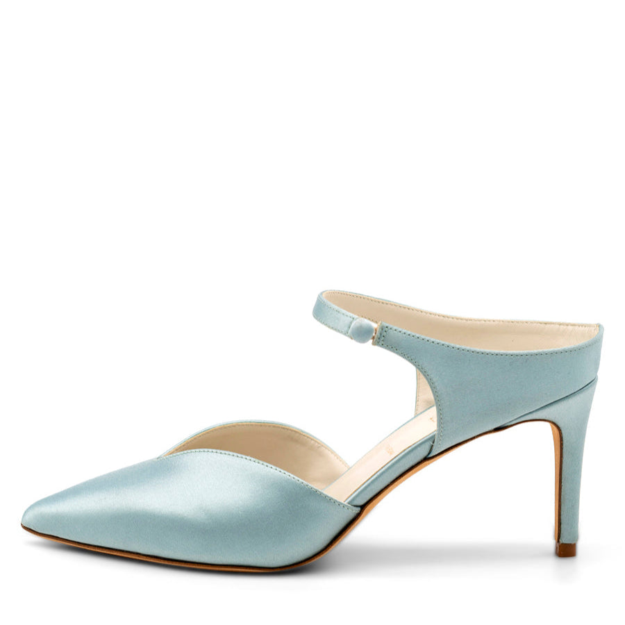 A light blue satin pump with a pointed toe and a heel strap, set on a white background.