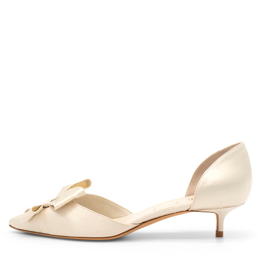 A beige pointed toe d'Orsay shoe with a kitten heel, displayed on a white background.
