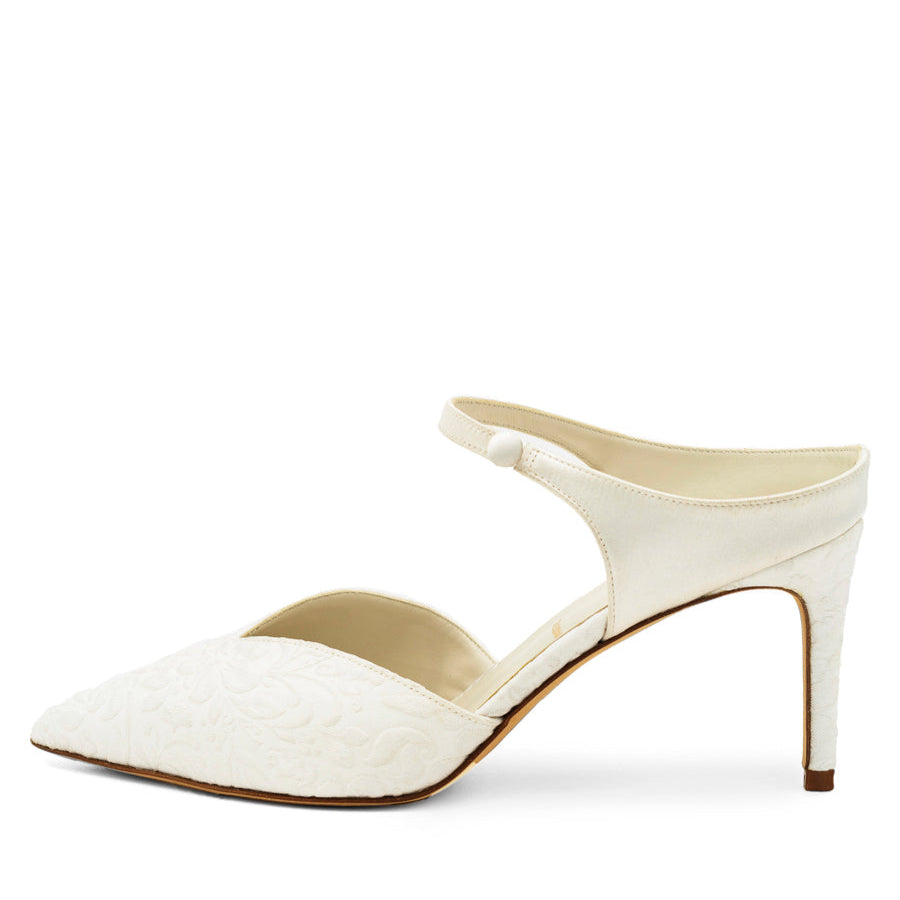 A white satin pump with a pointed toe and a 3 inch heel, with a slim ankle strap, on a white background.