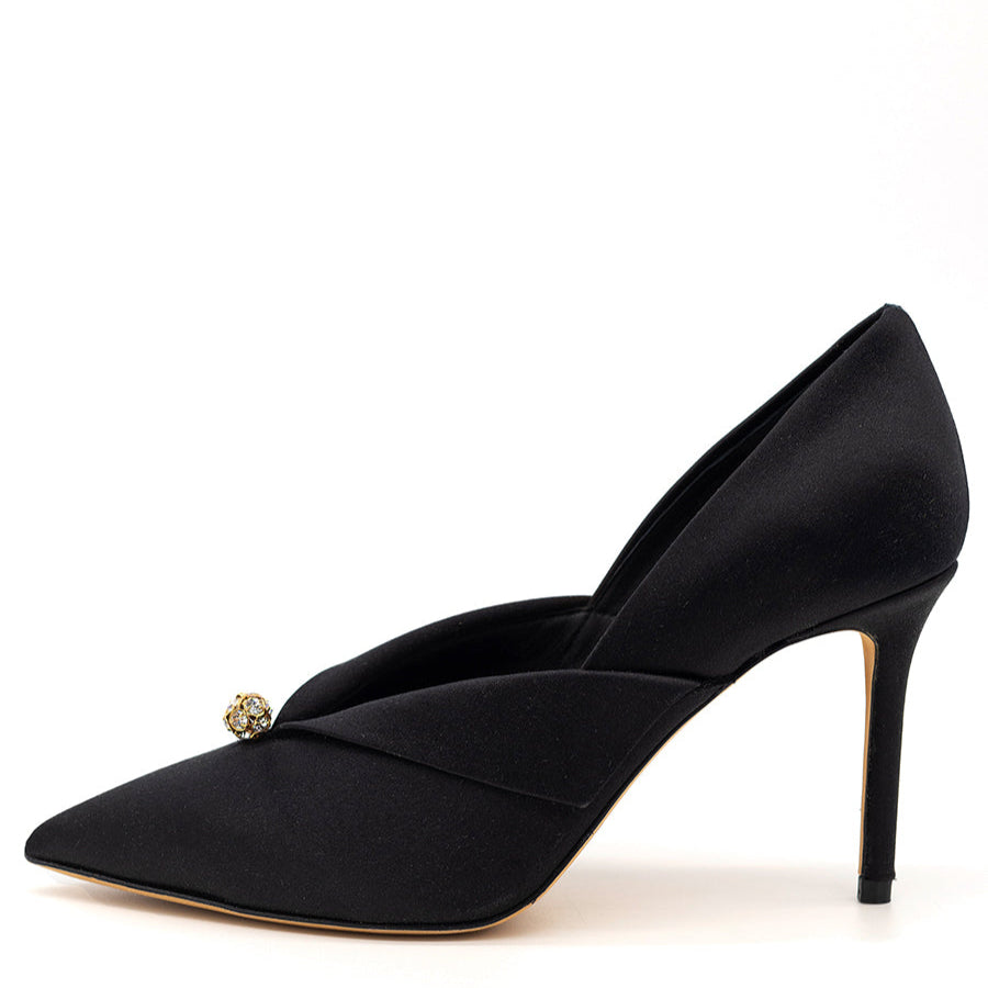 A black pointed toe pump with a satin finish and leather details, including an insole and sole, featuring a 3-inch heel and adorned with crystal gem stones.